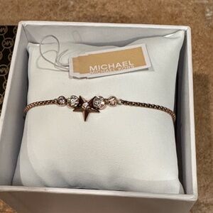 Mint Michael Kors starburst rose gold bracelet with tags $85!